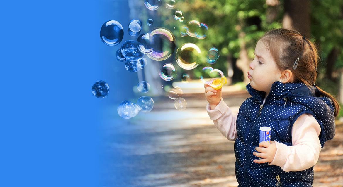 Child blowing bubbles